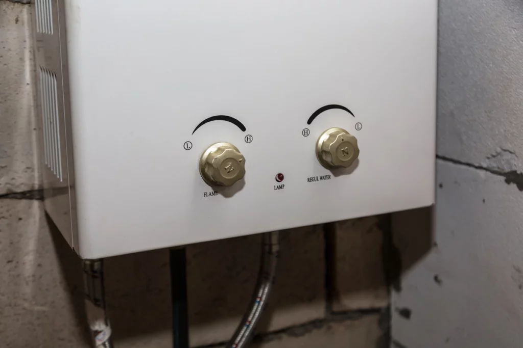 close up of tankless gas water heater installed in home boiler room