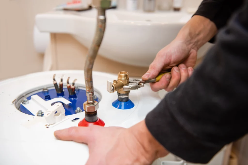 plumber installs long lasting water heater
